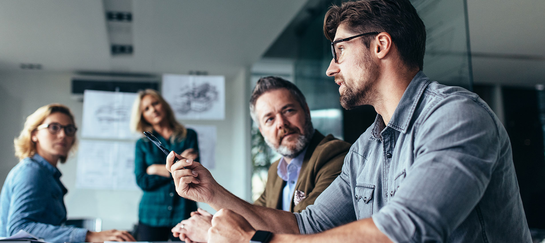 Team Of Professionals Discussing Over New Business Project