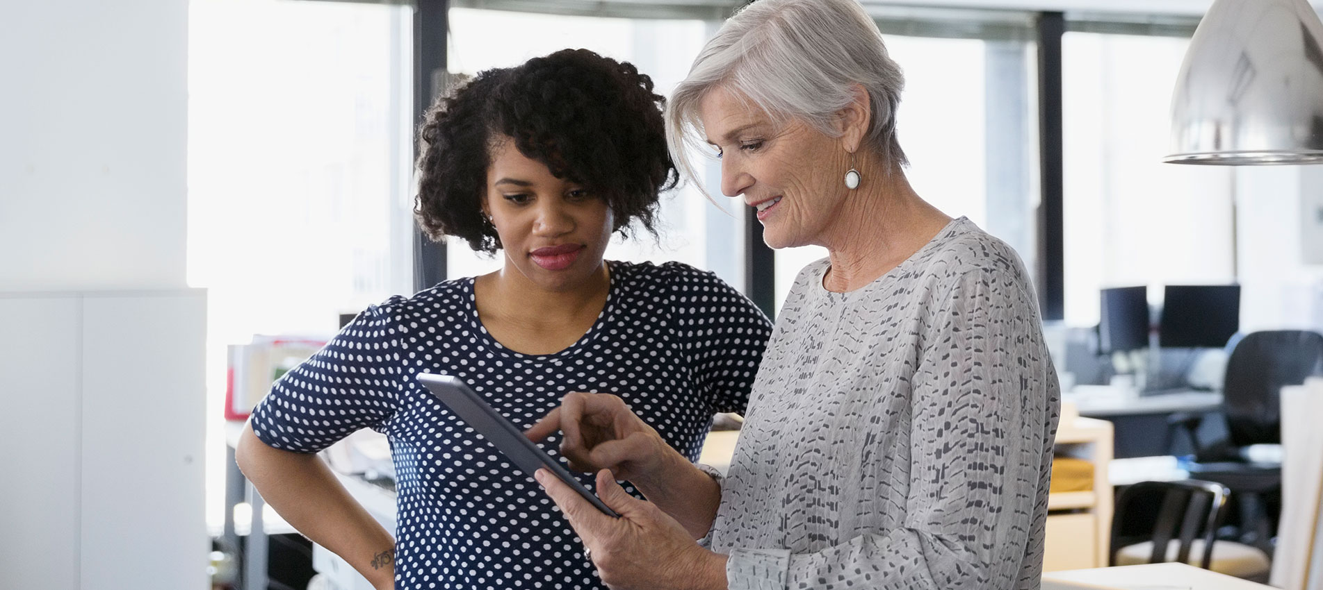 Designers Using Digital Tablet In Office
