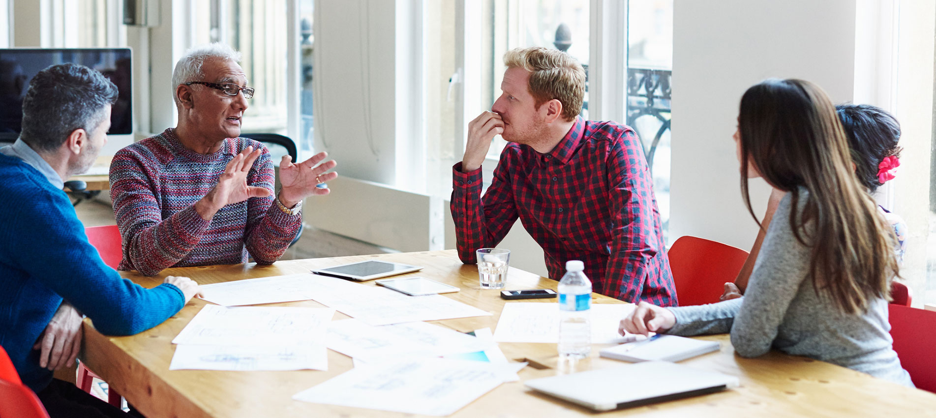 Coworkers-discussing-a-project-at-conference-table