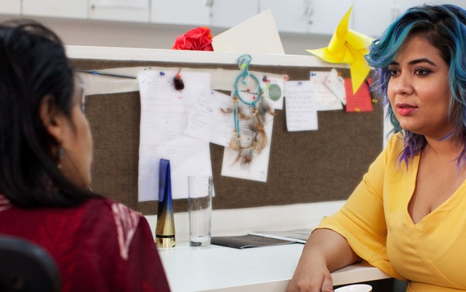 two employees in discussion