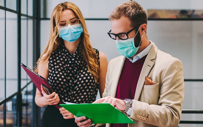 Business People Wearing Face Masks At Work During COVID 19 Pandemic