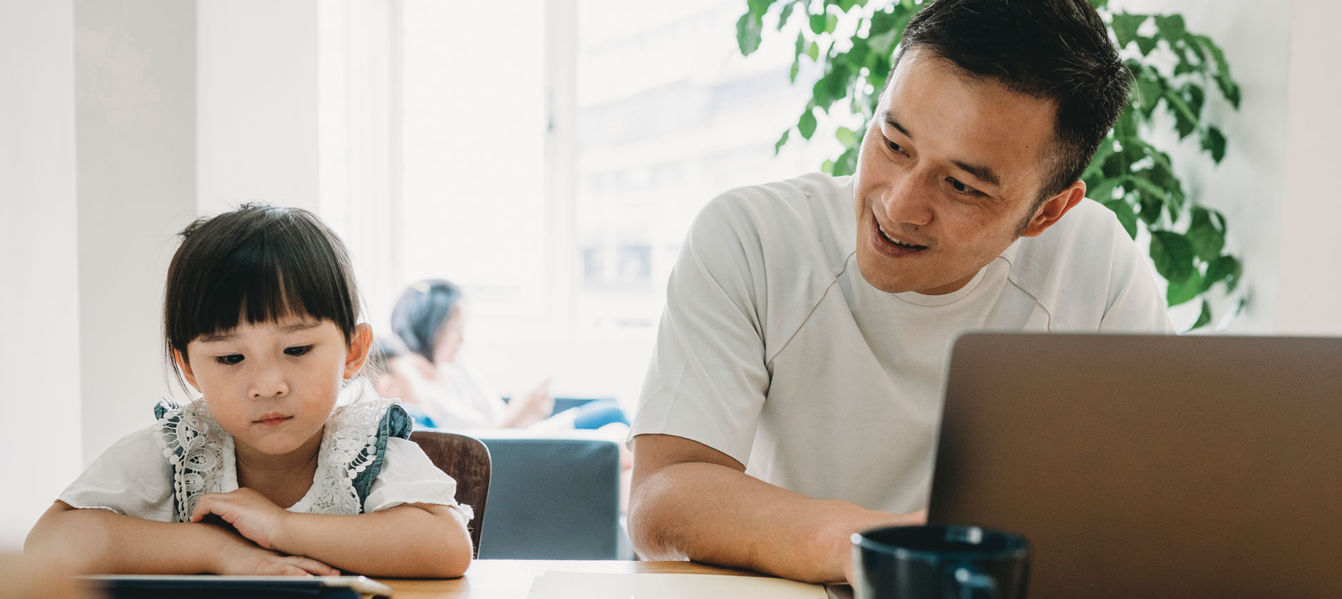 Male employee at home with smiling with his daughter after work