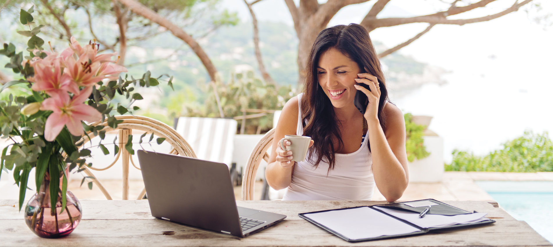 Female employee at home working on her laptop