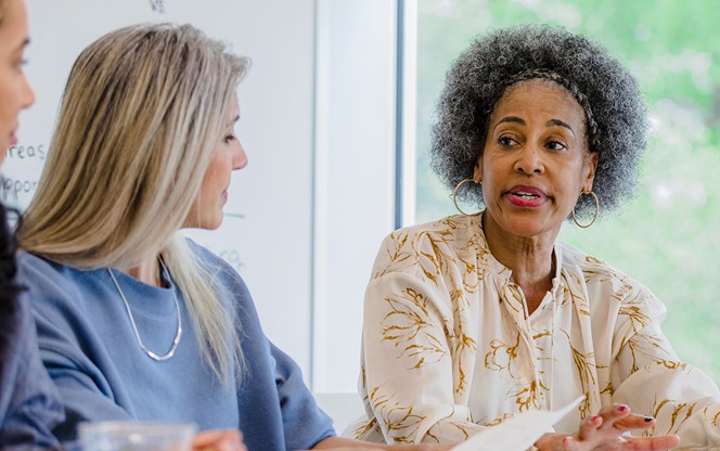 Senior Adult Female CEO Makes A Serious Point During Meeting