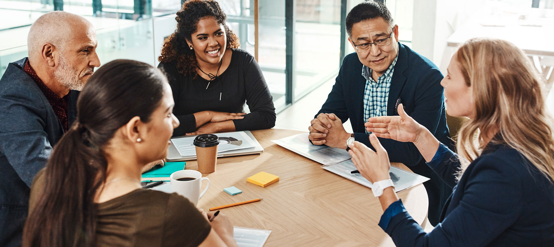 Shot Of A Diverse Group Of Businesspeople Having A Meeting