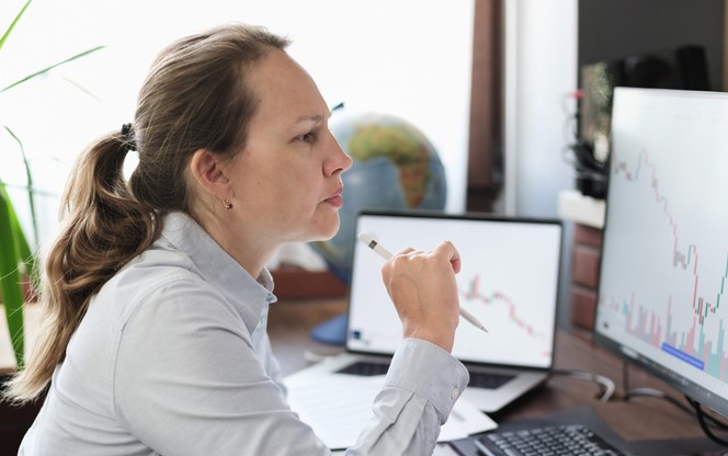 Business Woman Working In The Office On Stock Market Exchange Data