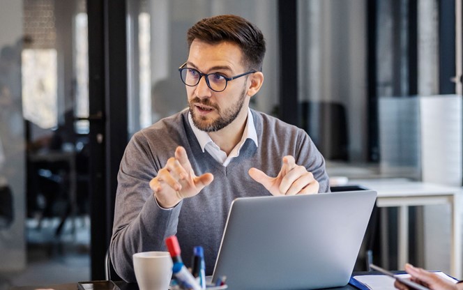 Businessman Discussing Technology Trends With A Group Of People