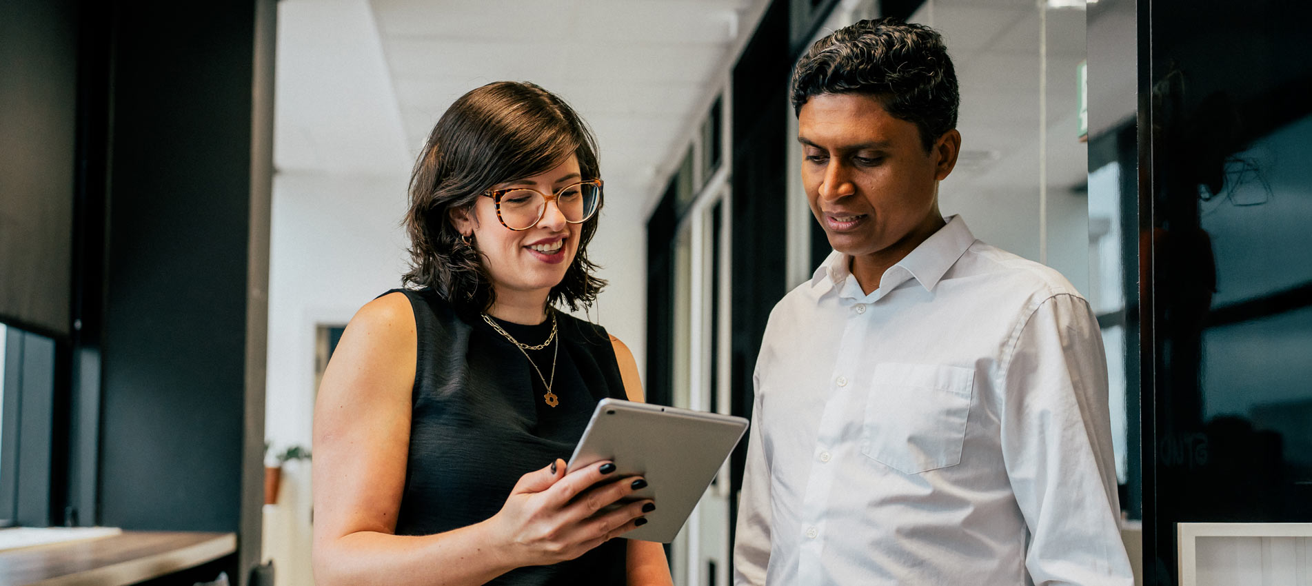 Two Business Coworkers Talking In The Office