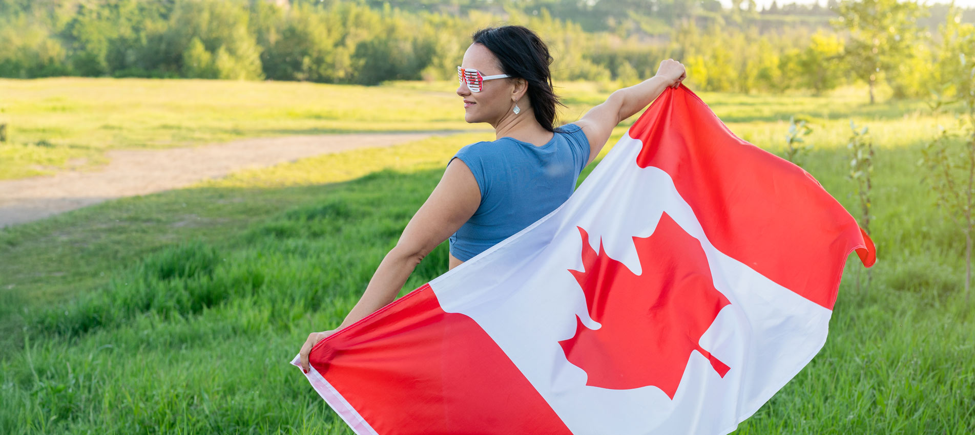 Young Woman With Canadian Flag Celebrating Outdoor